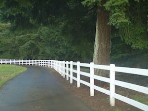 Vinyl picket fence along a driveway in Portland OR