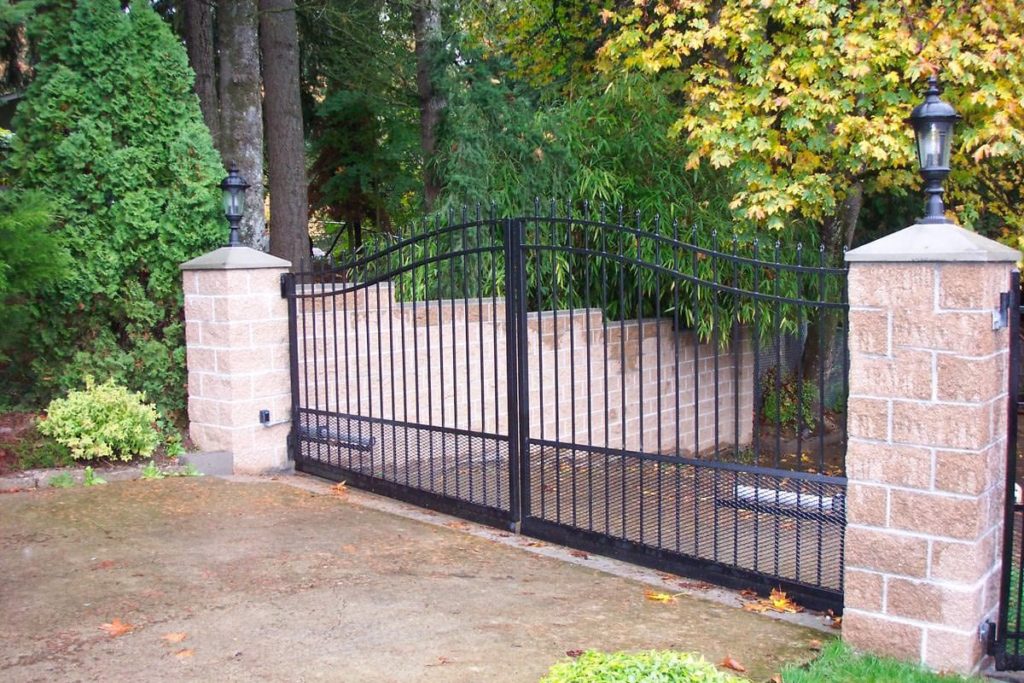 Black, wrought iron driveway gate