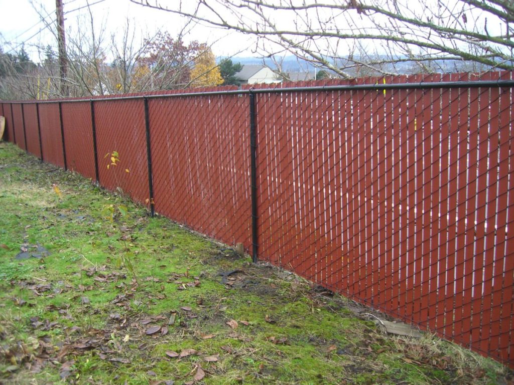 Chain link fence with red slats