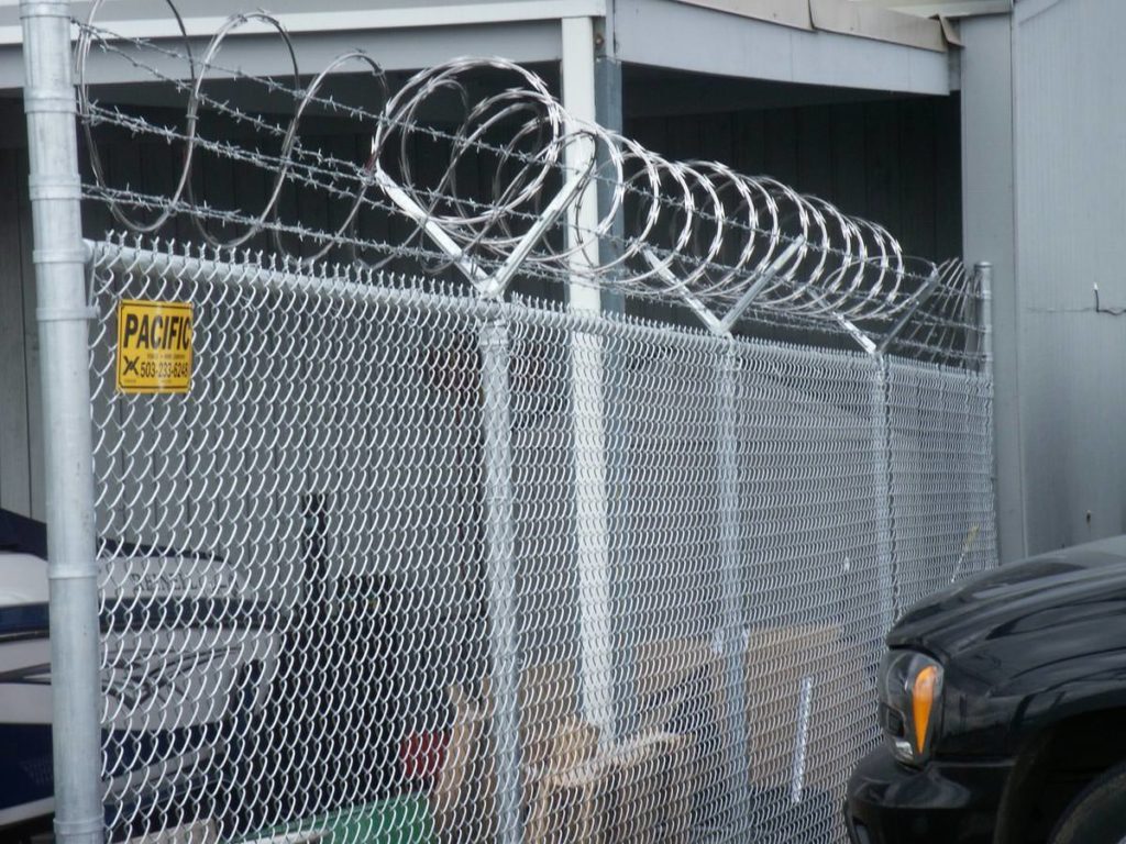 Chain link security fence with razor wire