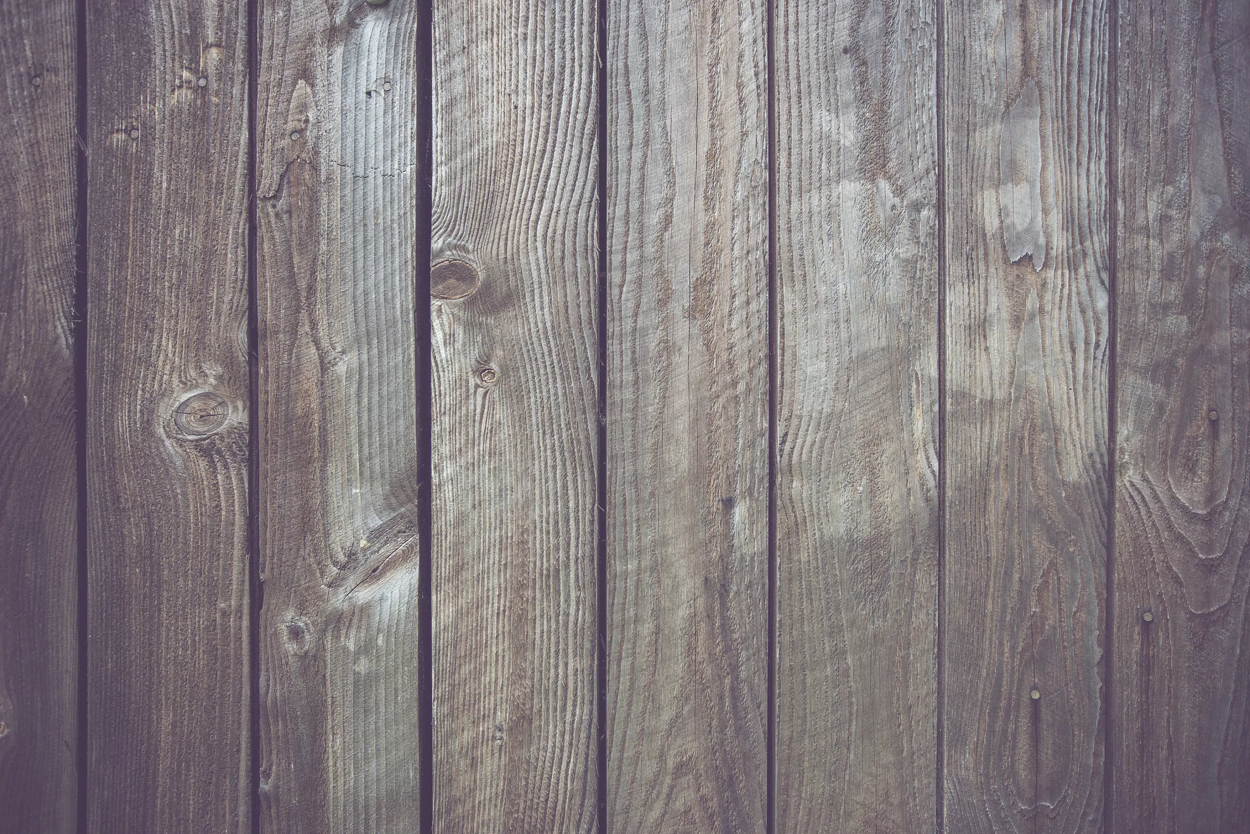 Wooden board background to illustrate How to Replace a Wooden Fence Panel