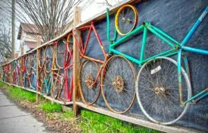 Colorful bikes within a fence frame
