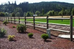 custom wood fence with different types of fence posts