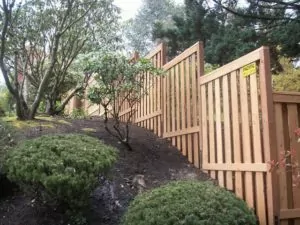 wooden fence on hill to help illustrate wood fence removal