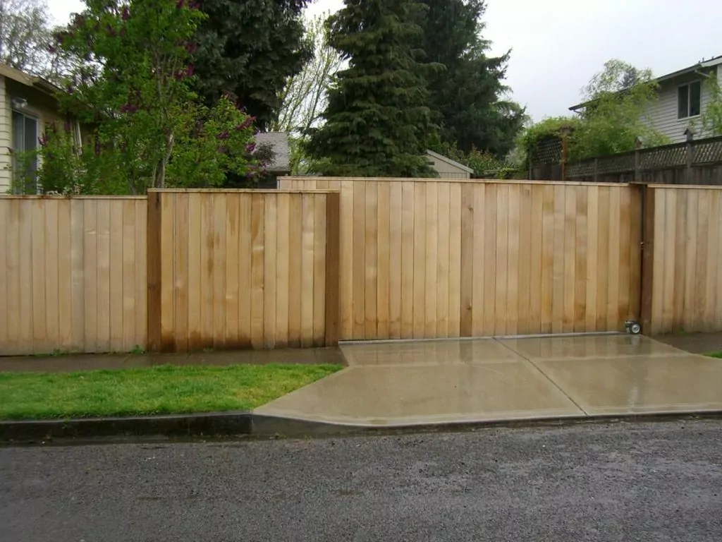 A large cedar gate incorporated into a fence to help illustrate privacy fence Portland.