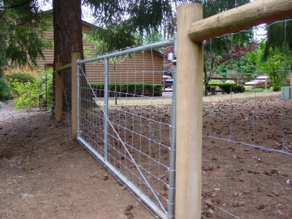 Farm gate made from wood framing and wiring to illustrate best ways to fence a farm.